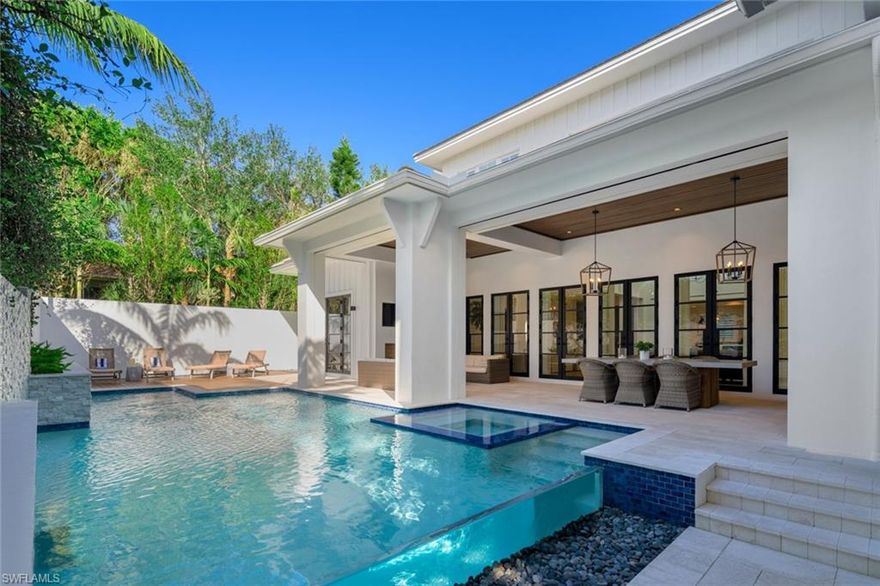 Experience luxury living redefined in this magnificent single-family home, situated in the heart of the Residences at Mercato! This quiet gated community offers urban living at its finest, while just minutes from the famous Vanderbilt Beach. The home is adjacent to the very best in dining, shopping and entertainment in Naples. Your gorgeous coastal contemporary home awaits, with a custom outdoor oasis, an open floor plan, and designer touches throughout. This 6,334 square foot home has 6 bedrooms, 5 full baths and 2 half baths, an office, a den and family room. You’ll find a sun-soaked great room with high volume ceilings and a gourmet kitchen that features Wolf, Thermador and Miele appliances, including a double wine tower. Outside, relax in an unexpectedly large private outdoor oasis, which features a custom infinity pool with a see-through glass wall. The outdoor kitchen is equipped to feed crowds of any size, and the spacious covered lanai includes dining and lounging areas with a fireplace and a second outdoor TV. This home is filled with special features you will fall in love with. It comes elegantly furnished so you can move right in. Come experience this Mercato gem today.