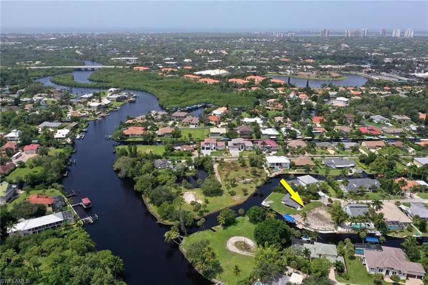 Build your dream home on this one of a kind gulf-access lot, located in a peaceful waterfront community less than 5 miles from the beach! This pie-shaped tip lot is positioned at the intersection of two wide water canals and has over 135 feet of water frontage.  Brand new seawall AND boat dock in 2020, along with an 8,000 lb boat lift with canopy. Lot has been cleared and prepped for construction.  Geo-report and survey are available.