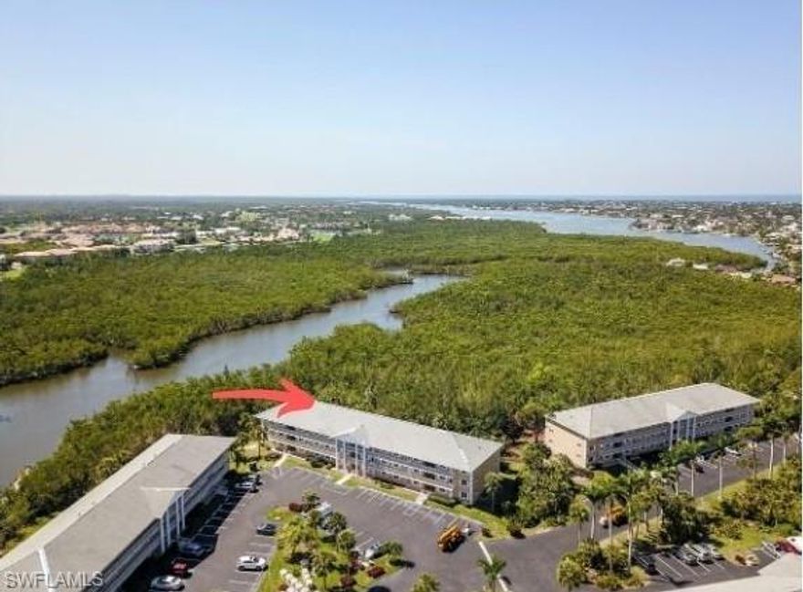 This spacious, extra-wide second floor condo is uniquely positioned to capture the highly sought-after southern exposure, offering a peaceful setting overlooking the mangroves. Designed with comfort and style in mind, the unit features newer shaker-style, soft-close cabinetry throughout, including the pantry and bathroom vanities. Each cabinet is topped with elegant quartz, adding a touch of sophistication. Laminate flooring extends through the entire condo, providing both durability and aesthetic appeal.  Naples Sandpiper Bay Club offers 2 pools, docks upon availability (purchase or lease), outdoor grilling areas and a social clubhouse.  It’s minutes from the Naples Pickleball Center (home of the US Pickleball Open) and the world-famous Naples Botanical Garden.  Minutes from the boutique shopping & gourmet dining of 5th Avenue So. and the renown beaches along the Gulf of Mexico, you can’t beat this location for the money.   …and The  Sunsets are Free!