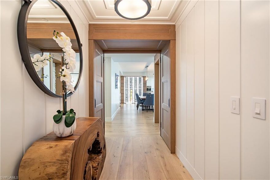 This incredible home masterfully designed by Wendy Berry showcases incredible views of the Gulf of Mexico and marina. Every detail has been meticulously curated throughout this gorgeous 3 Bdrm+Den home, this desirable end unit is very light & bright with an open floor-plan, showcasing the view out a wall of glass. Enjoy a sunset glass of wine on your oversized lanai with glass railings. Custom details such as temperature-controlled wine display case, built-in bar, & natural gas fireplace along with custom millwork are throughout the home.  Gourmet kitchen is equipped with Sub Zero and Wolf appliances, with a large island, and butler pantry perfect for entertaining. Tranquil Master Suite with sweeping Gulf views leads into a spa-like bath and fully custom walk-in closet. Two designer en-suites are perfect for your guests. Work from home in the perfect custom den with side windows and balcony. As a resident of Kalea Bay, enjoy a higher standard of living, with access to a rooftop pool, open-air fitness center, Resort amenity center with three pools & restaurants, tennis, pickle ball and Kalea Bay is PET FRIENDLY