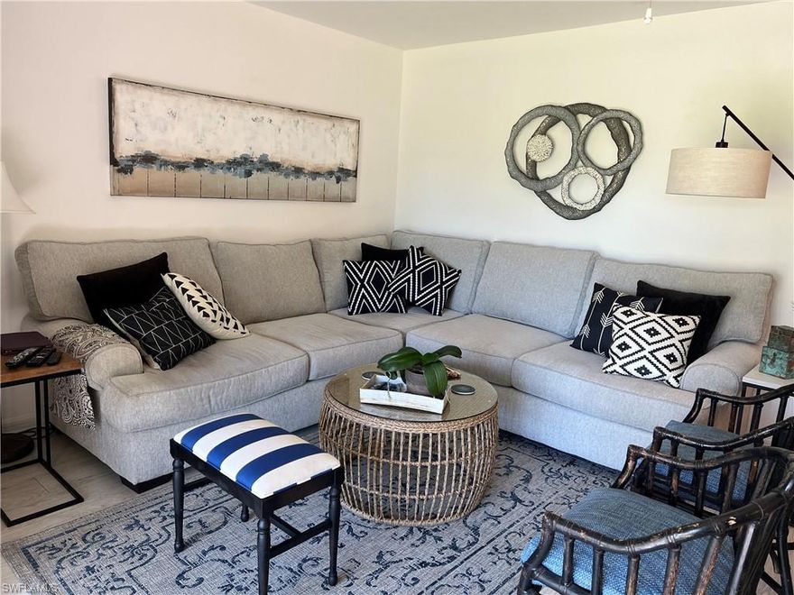 Step inside this lovely first floor condo and watch the golfers on the 4th hole at the Countryside Golf and Country Club.    This home features two full bedrooms, 2 full baths, brand new ceramic tile flooring in the main living area and a bay window in the kitchen, which also features Corian countertops.  Outside of your screened back lanai equipped with a storm shutter is the 4th green and outside of your front door you will be steps away from a large, heated pool, tennis courts, pickle ball and a barbeque area.  This unit is a social unit which means that while owners can play golf, they will not be able to join a league or play in any tournaments except as a guest, and they would have to pay greens fees and for a cart.   Everything else that the club offers is a part of the social membership.  There is something for everyone at Countryside...a full service restaurant and bar, a newer fitness centers with a staff attendant, physical therapy, outdoor concerts, weekly dances, bocce, tennis, bridge, book clubs,cards, pickleball, Family Feud nights,karaoke and club sponsored trips;  As we say in Naples and specifically in Countryside..."it doesn't get any better than this!"