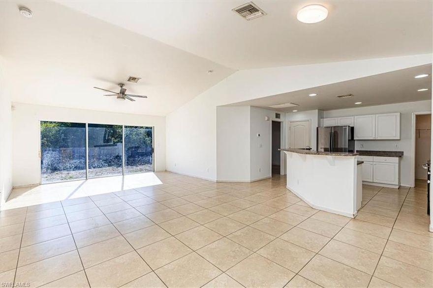 Situated on an oversized corner lot on a quiet dead-end street, this well-positioned home offers the perfect blend of privacy and convenience. Located just off Sunshine Blvd N, you’ll enjoy a peaceful setting while remaining just minutes from local shopping, dining, and everyday essentials. Inside, you’ll find an open floor plan with a cathedral ceiling that adds a sense of space to the main living area. The kitchen is truly the heart of the home, highlighted by an extended wraparound breakfast bar, ideal for gathering with family and friends while cooking or hosting. You’ll also find a generously sized pantry, along with easy access to the indoor laundry room and attached two-car garage for added convenience. The primary bedroom includes a walk-in closet, and all three bedrooms offer comfortable sizing. Tile flooring runs throughout the home for easy maintenance. A screened-in front porch provides a relaxing outdoor space, while the fenced backyard offers added privacy and plenty of room for pets, play, or future outdoor enhancements.