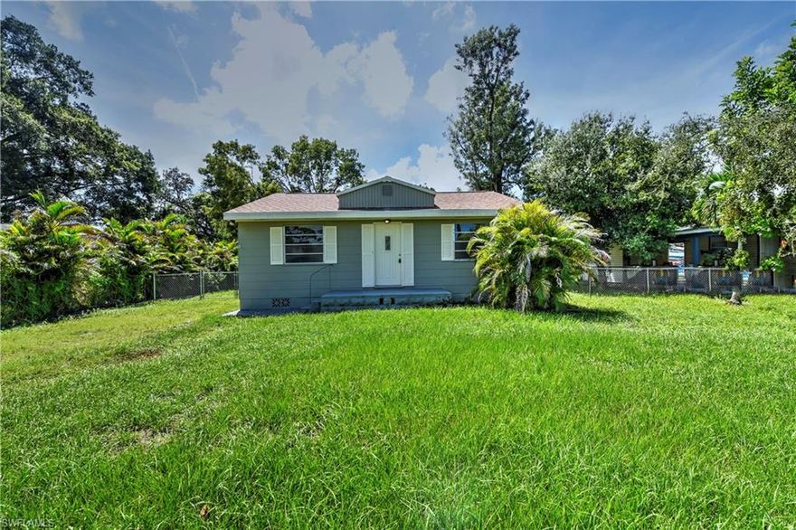 NEW ROOF and NEW SEPTIC * Charming 2 bedroom, 1.5 bath home with a detached 1 car garage in the heart of Fort Myers.  Sitting on a ¼ acre lot, this home has wood flooring in the living areas and carpet in the bedrooms.  Brand new roof on both the main house and detached garage.  Screened in patio overlooks spacious fenced in back yard. 1 car detached garage could also be used as a work shop as it has electric.  Bonus room in back of house could be used as an office or 3rd bedroom.  House has a brand new septic system.
