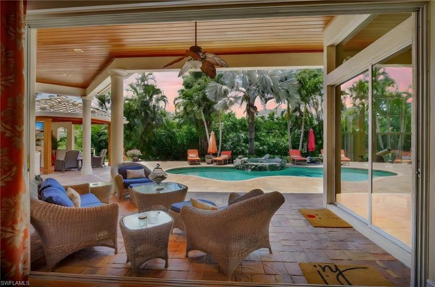 Price Reduced – Now Listed Below Appraised Value! Seller financing available
Take advantage of this incredible opportunity to own a stunning home with immediate equity.
Enjoy private beach access and a sparkling saltwater pool, all in a prime location ideal for a forever home or the perfect family retreat.
Don’t miss out on this exceptional value—schedule your tour today!  This Beautiful home is Nestled on a private lot of almost half an acre, this custom-built home boasts the prestigious address of Crayton Rd. As you drive into the circular driveway lined with beautiful royal palm trees, hidden behind landscaping that creates a sense of privacy, you’ll be greeted by either your oversized three-car garage or the inviting front door of this residence.

The open floor plan with soaring 12-foot ceilings creates a spacious and airy atmosphere, while the split four-bedroom with a den floor plan ensures everyone has a private bath. The Jack and Jill bedrooms share a common bathroom, while the third full bathroom leads to the pool. A large pool table room, complete with the pool table, adds to the home’s entertainment features.

The master bedroom is a true sanctuary, complete with His and her closets, a large shower with double sinks, and a soaking tub. Waking up to the view from the sliding glass doors in front of the bedroom will make every day feel like a vacation. Just beyond those doors lies your private oasis, a backyard that offers a perfect blend of openness and privacy.

A saltwater pool and spa, complete with a fountain, marble fireplace, and large screened TV, awaits your relaxation. This backyard is the ideal spot to enjoy Naples’ perfect climate.

But that’s not all! Residents of this prestigious Mooring’s subdivision enjoy a private beach, perfect for sunsets, all within walking distance. Additionally, the convenient location offers easy access to stores, restaurants, and an executive golf course.
So, prepare to have a life you don’t need to vacation from!