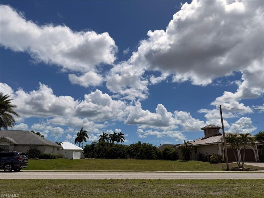This is a highly desirable, buildable, vacant double lot located in one of the most coveted Southwest Cape Coral areas. It is just a half mile from Sands Park. Build a house to your specifications and enjoy sunshine on your lanai and pool throughout the day as this lot faces south and provides the best of southwest Florida's sunshine. This lot is just a half mile from Sands Park. You and your family can take a scenic walk through this upscale community to this beautiful facility that the whole family can enjoy. It is the best of Recreation and Parks as it includes tennis, pickleball, basketball, an outdoor playground with a variety of of gym equipment, bathroom facilities, a walking path, picnic tables and a large parking lot. This is also dog friendly. It is part of the city’s GO Bond parks master plan approved by voters in 2018 and it opened in 2023. The park also has bocce ball courts, a putting green, corn hole games, shaded pavilions with picnic tables, a butterfly garden, and burrowing owl habitats with several clusters of burrows in a large protected green area. All the amenities found in most gated communities but without the fees! This property is also located close to the South Spreader and the mangroves which provide protection from storms. Cape Coral is known for its waterways and this location is ideal as it is close to marinas and boat launches. This is also conveniently close to many excellent restaurants including fine as well as casual dining, schools, churches and medical facilities. Cape Coral also has its own beach area which is being updated and is convenient to this property. Fort Myers Beach is 17 miles away. Why pay a premium for a waterfront property when you can take your boat to a launch and not have the extra expenses, insurance, and maintenance of a dock, slip and seawall. This is an opportunity to invest wisely and build equity while including features that will make this the ideal home for you and your family. Or invest now in this property while it is available and hold it in your portfolio for the future.