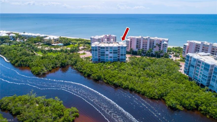 STUNNING, coastal contemporary delight fully renovated & move-in-ready with sweeping Bay views. Enjoy morning sunrises on your Bayfront lanai watching boats cruise by & dolphin splashing in the Back Bay. Then, from a bistro table in your foyer beyond your front door, watch the sunset over the Gulf of Mexico just across the Blvd. Steps to deeded beach access for Barefoot Beach residents & the optional premier “Club at Barefoot.” New driftwood-style plank tile floors & a soothing cool paint color palette highlight the gorgeous kitchen/bath renovations. The renovated kitchen offers white gray honed granite counters, subway tile back splash, crisp white cabinetry with custom pull-outs & custom extended wet bar. Both baths renovated with granite counters, custom cabinetry, slate wood-look tile floors & shower walls, frameless shower enclosure & more. COMING SOON: Brand-new clubhouse with state-of-the-art beachfront fitness center, beachfront swimming pool & community room. Barefoot Beach residents enjoy 3 miles of beachfront, 2 pools/spas, manned/gated entry & on-site mgmt. Excellent North Naples, Collier County location minutes to Mercato, Waterside Shops & easy access to RSW Airport.