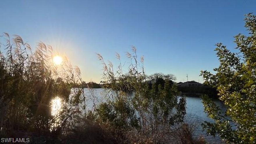BEAUTIFUL OVERSIZED LOT with Amazing View into Intersection Canal! WESTERN EXPOSURE! – This Lot is an excellent opportunity in a fast-growing, but tranquil NW Neighborhood with new construction homes being built. Enjoy gorgeous SUNSETS at your future Lanai. – This property is close to restaurants and shopping plazas. Just a short drive to Fort Myers and Punta Gorda airports. – This is your chance to own ONE OF A KIND LOT and build your DREAM HOME in a quiet, growing neighborhood.