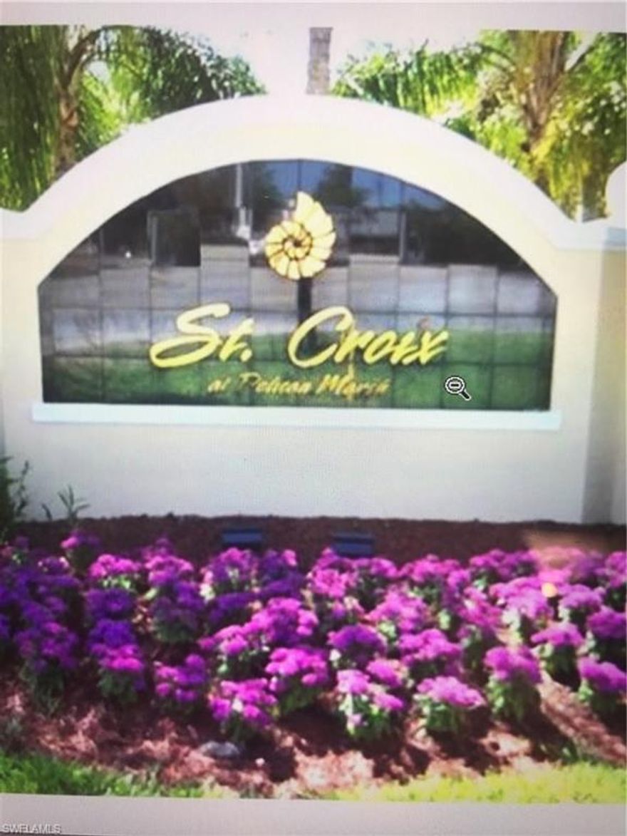 Solid buy in Saint Croix: First floor home.  Lake view from lanai.  Deeded garage space with automatic garage door.  Classic two bedroom layout with open kitchen, dining and living room.  Needs some love and attention - the price reflects the work that needs to be done.  Paint, flooring, appliances and new kitchen appliances and countertops will transform this place!  The water view and deeded garage will never change.....and add solid value!  Come see it today!