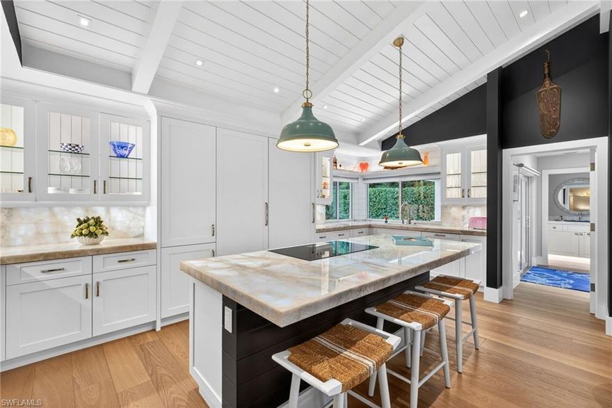 Nestled within Pinecrest, an exclusive enclave inside Pelican Bay, this recently reimagined residence presents a rare blend of privacy, sophistication, and the exceptional coastal lifestyle for which Pelican Bay is known. The home has been entirely renovated with an extraordinary level of design, craftsmanship, and meaningful investment throughout.  Legno Bastone wide-plank European oak floors, bespoke millwork, designer lighting, Lutron lighting and automated shade systems, and a stunning custom kitchen with Cristallo quartzite countertops and backsplashes, premium custom cabinetry, and top-tier Thermador and Subzero appliances define the interiors. A rare opportunity to own a beautifully finished and thoughtfully upgraded home in one of Naples’ most sought-after communities.
Pelican Bay is one of Naples’ most coveted beachfront communities, prized for its rare combination of natural beauty, privacy, and exceptional resident amenities. Residents enjoy nearly three miles of white-sand beach, private beach access with tram service, beachfront dining, an active racquets program, fitness and wellness offerings, and a lifestyle that blends coastal relaxation with year-round recreation. With mangrove preserves, nature paths, and a setting adjacent to many of Naples’ premier destinations, Pelican Bay offers a distinctive standard of living that is unmatched.