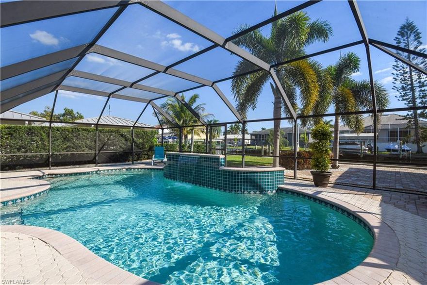 Waterfront bungalow in Bonita Springs w/ DIRECT access to Gulf! Situated on a dead end road in a non-gated boating community, this home is a water enthusiast's dream and is being offered fully furnished. Perfect for seasonal or annual living, this meticulously maintained home features a great room design, tile flooring throughout, tankless water heater, covered carport, & an auxiliary shed (built in Nov 2017) w/ electric. Wonderful outdoor living w/ a massive screened in rear lanai (420sf) that features new screening (Dec 2018), pavers throughout, solar heated pool w/ waterfall, long under truss area, open waterfront lanai w/ pavers, and a spacious grass area in rear of home. For those who love to spend time on the gorgeous waterways of SWFL, this home has all you need w/ a wood boat dock, jet ski lift, and a long covered indented boat slip w/ electric & water available. On a wide canal that had the seawall replaced in 2010, and is just around the corner from Little Hickory Bay having direct access to the Gulf of Mexico w/ NO bridges. Fantastic location- in Collier Co school system, only 1 mile from Barefoot & Bonita Beach, and has easy access to US41, I-75 & Estero Island.