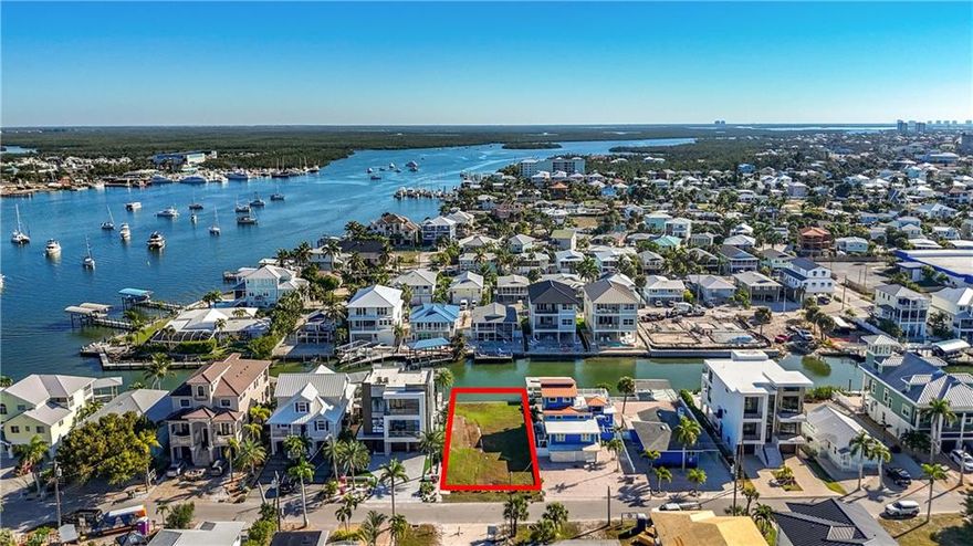 Fantastic north end lot located on a Gulf access canal with a 50-foot seawall. This location offers exceptional access to the Gulf of Mexico just a few houses down from the bay entrance and out under the Matanzas Pass Bridge. Build your home in this great location. It's a boaters and beach lovers paradise.  The lot is in a quiet north end neighborhood of Venetian Gardens within walking distance to the beach, restaurants and shops. Weekly rentals allowed.  Lot is next to 2 homes that are for sale as well.  447 Palermo MLS # and 453 Palermo see MLS           #  May be bought separately or all three together.