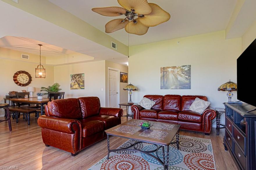 Here's the very desirable Carlyle Floor plan you've been waiting for and GOLF IS INCLUDED. This very clean and nicely appointed turnkey furnished 2 bedroom/2 full bath features an open floor plan, wood and tile flooring in the main living area and large bedrooms.  Enjoy the exceptional view of the golf course, lake and fountain from your private screened lanai. Discover Forest Glen, an award winning bundled golf community that also features tennis, pickle ball, miles of nature trails and beautifully maintained. Conveniently located close to downtown beaches and Fifth Ave.