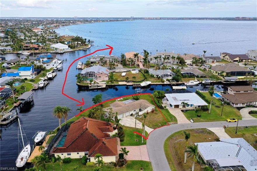 AAA++ Location!! Beautiful Corner lot at intersecting canal with seawall in place!! Located in SW neighborhood near Tarpon Point and for boaters even better than River front as quiet waters and no wakes. Get on the river in about 1 minute. Quiet street ensures your privacy, enjoy quick boating access to the Gulf of Mexico! Assessments are in and fully paid.  180' of water front will guarantee you docking even a real big boat without blocking the water view from the house to be built.

Don't even look on the house, it will get demolished on seller's costs once a clean contract is in place.

Look no further! From this property, you are under 2 minutes on the river. Build your Florida dream home here and enjoy the extremely short way by boat to your fun time and all amenities on land within less than 5 minutes.  Only 3.5 miles to SE 47th Terrace where you find multiple bars, restaurants and special events.