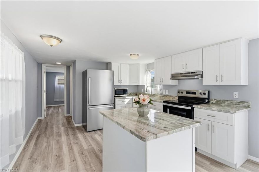 This property is located in a 55+ community that offers many great amenities. This newly remodeled 2-bedroom, 1.5-bathroom home is ready for its future owner and includes brand new stainless steel appliances, gorgeous granite countertops, new kitchen cabinets, new washer/dryer combo located inside the home, and lots of windows with natural light. Updates include a new roof, new carport, new water heater, new AC unit, new flooring, updated plumbing and electrical, and a spacious shed for extra storage. The community has a low monthly HOA of only $174 and includes access to a heated swimming pool, 9-hole golf course, clubhouse, shuffleboard, pickleball, bocce ball, free boat storage and docking, and a boat ramp with access to the Caloosahatchee River and the Gulf. There are many ways to enjoy Florida living in this community. All offers are welcome!