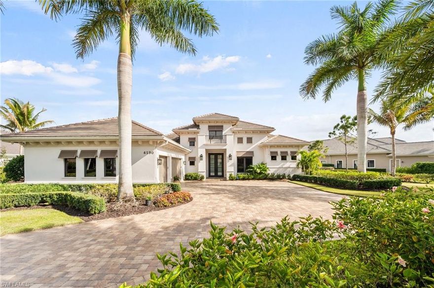 IMMEDIATE GOLF MEMBERSHIP AVAILABLE-Experience refined luxury in this stunning custom residence by Stock Development, where exceptional craftmanship meets elegant design and serene water views. Through grand double glass entry doors, soaring ceilings welcome you into a spectacular open-concept living space that seamlessly connects the living room, dining room, and chef's kitchen with tranquil outdoor vistas. Designed for both beauty and function, the home features impact-resistant glass, a full-house generator, and an open floor plan ideal for effortless entertaining. The chef’s kitchen impresses with a large seating island, wine refrigerator, oven, warming drawer, gas cooktop, and a spacious walk-in pantry. The generous primary suite includes a sitting area and French doors leading to the lanai. The spa-inspired bathroom offers double vanities, a large walk-in shower, and a luxurious soaking tub—an ideal retreat after a day on the golf course. Three additional en-suite bedrooms ensure comfort and privacy for guests. Outdoor living is elevated to resort-style perfection.
The expansive lanai showcases a rich wood-paneled ceiling, inviting fireplace, and a full outdoor kitchen complete with grill, gas pizza oven, refrigerated drawers, sink, and icemaker. Enjoy the gas-heated saltwater pool and spa enhanced by striking water and fire features. Notable upgrades include two new HVAC units (2024), a full-house generator, security system with cameras, epoxy-coated garage floors with built-in storage, and a dedicated dog run. This home blends luxury, functionality, and breathtaking water views—an exceptional residence with immediate golf priviledges in a premier golf community.