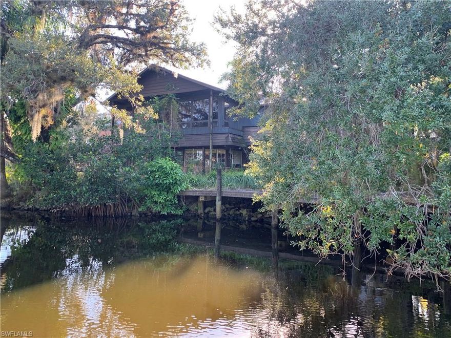 Welcome to Paradise. 5 acres on the rarely available Orange River with privacy to build your dream house or renovate the existing unique house that has been partially renovated already and has a new steel roof installed. Plenty of room for horses with an existing horse barn with 6 stalls. Enjoy a small creek running through the property or sit and relax at the pond. Watch Manatees swimming in the Orange River or if you love fishing this places has it all. Would make an incredible Airbnb or family compound. The possibilities are endless. Don't miss this chance to own a piece of Paradise.