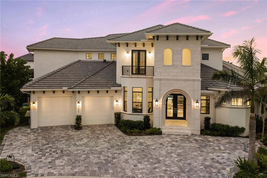 Absolutely stunning RK Reiman-built home with incredible southwestern views! Custom built in 2020, this " like new" home will not disappoint. 5 bedrooms, 6 full baths, den, media room and incredible wine room. Boasting over 4,600 square feet under air, over 7,100 total square feet. Soaring 13' ceilings from the moment you walk in. Open-concept floor plan with great room, living room and separate dining area. Enter the foyer with beautiful wood and glass doors, incredible climate-controlled wine room that hold over 650 bottles of wine, and striking dining area with spectacular crystal chandelier. Porcelain and wood flooring throughout, 2-story elevator, oversized master suite with custom closets, and stunning master bath. Dream kitchen with water views boasts Thermador appliances, quartz counters, custom cabinets and lighting. Massive tiered outdoor living area includes 80' dock with retractable jet ski lifts and 20K boat lift. Huge lanai complete with screens and shutters, outdoor kitchen, bar, sitting area and fire pit. Upstairs open lanai off game room/media room with beautiful sunsets year round. Jaw-dropping one-of-a-kind family home being sold furnished for your convenience!