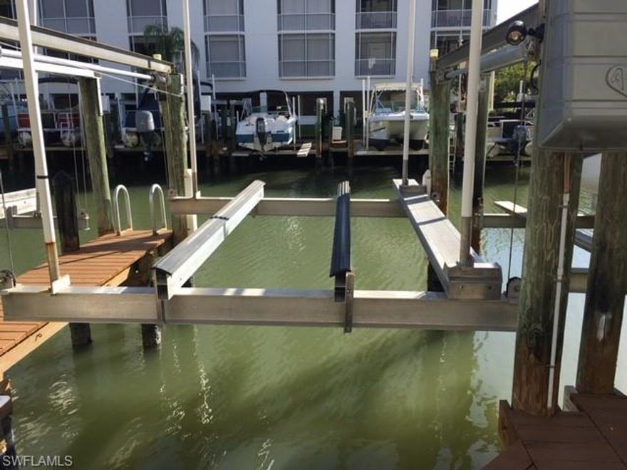 Hibiscus Pointe Boat Dock #102.   Well maintained.  Newer motors & electric box.  10,000 lb lift.  Aluminum bunks.  Electric & water at the dock.