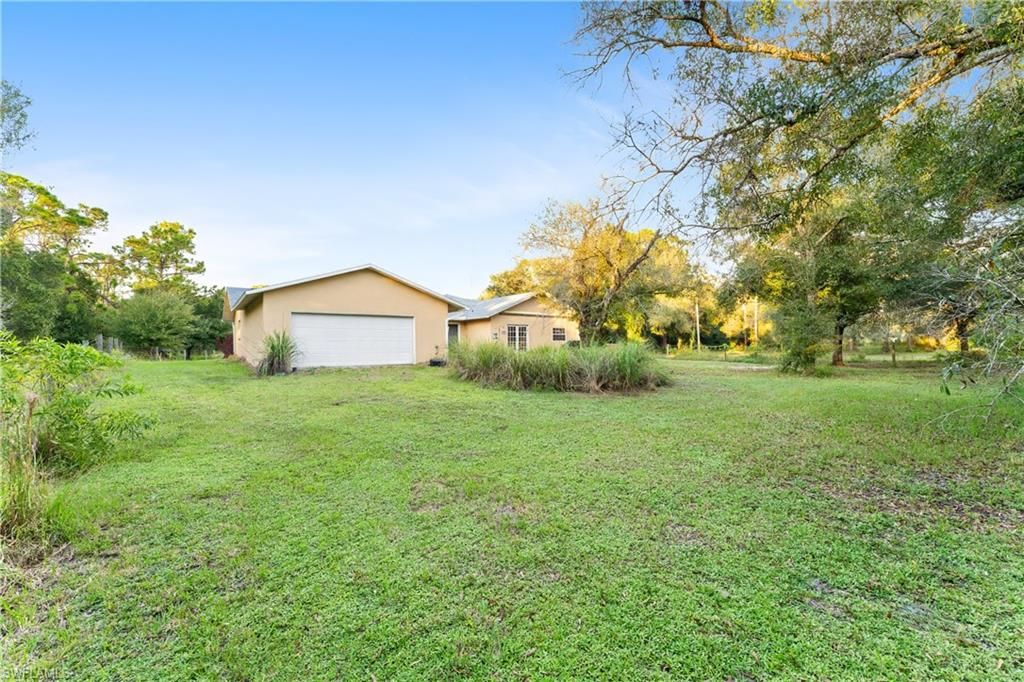 Photo of 9100 Henderson Grade, NORTH FORT MYERS, FL 33917 (MLS # 2025016794)