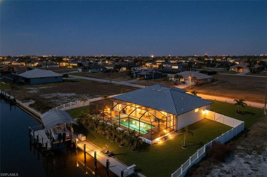 Gulf Access | New Construction | Triple Lot

This exceptional, newly completed Gulf access residence sits on a rare triple lot and offers 4 bedrooms, 3 baths, and a 3-car garage—thoughtfully designed for luxury, functionality, and true waterfront living. With 2,010 square feet under air and an impressive 4,298 total square feet, this home delivers the space and flow today’s buyers are looking for.

A standout feature is the recent $125,000 investment in a brand-new Trex dock system, including a full captains walk, 12,000-lb boat lift, dedicated canoe/kayak launch, and room to accommodate up to three boats along the rear of the property—a rare and highly desirable setup. The expansive waterfront is complemented by a new, fully fenced yard, providing a safe and secure area for children and pets while maintaining clear separation from the canal.

Outdoor living is elevated with a sprawling 1,702-square-foot lanai featuring an oversized heated pool with salt system, all within a full-length screened enclosure—ideal for entertaining or quiet evenings by the water.

Inside, the open-concept design is enhanced by soaring 12’ ceilings, 8’ doors, tray ceilings in the living area and primary suite, designer tile flooring throughout, and elegant soffit lighting. The chef’s kitchen serves as the heart of the home, showcasing 42” cabinetry, stainless steel appliances, high-end countertops with a waterfall edge, and a generous island perfect for gathering.

The primary suite offers a spa-inspired bath with frameless glass shower enclosure, while the convenient pool bath adds ease for outdoor enjoyment. Additional features include a metal roof, impact windows and sliders, gutters, oversized baseboards and casings, laundry room cabinetry, electric fireplace, whole-house reverse osmosis system even at the dock, paver driveway and pool deck, multiple paver walkways, and a complete irrigation and landscaping package with Floratam sod.

In my experience, opportunities like this—completed new construction, triple lot, extensive dock infrastructure already in place, and Gulf access—are exceptionally rare. Why wait years for seawalls, docks, and custom builds when this home is finished, upgraded, and ready to enjoy now?