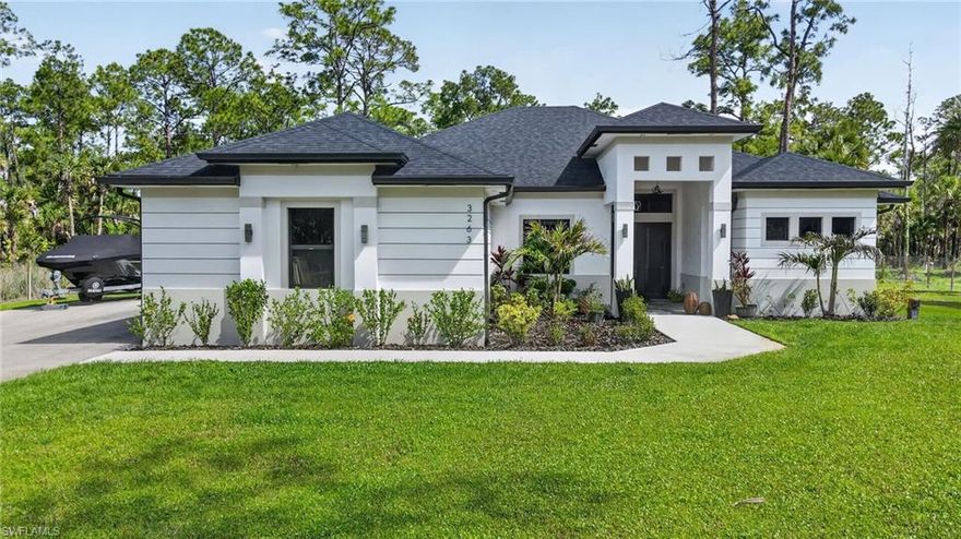 2023 OSIRIS MODEL. Escape to this sprawling 2.5-ACRE PRIVATE OASIS on a serene, private street. Boasting 100% UPLAND, this lot is fully secured with a NEW PERIMETER FENCE and cleared land to assist with your future projects. Inside, modern luxury meets smart technology with electric blinds on every window, accentuating the designer tray ceilings and elegant crown molding. Chef-inspired kitchen features genuine wood cabinetry, sleek Quartz countertops, and premium stainless steel. Retreat to a massive Primary Wing designed for royalty, complete with dual walk-in closets and a spa-style shower built for two. Savor the ultimate Florida lifestyle on the grand lanai, featuring a built-in outdoor kitchen overlooking your vast estate. This is the home you've been waiting for. You will see...