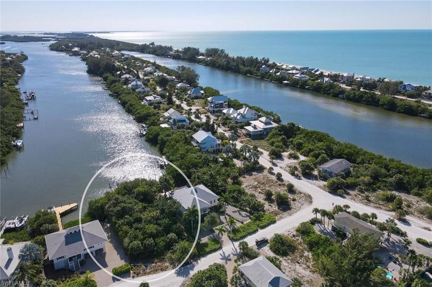 Palm Island Premier Building Lot JUST REDUCED...Only building lot with a full harbor view leading to the intracoastal waterway with no bridges to limit your boat clearance. Step out your backyard to your private boat dock or walk TEN houses to the entrance to your Palm Island Gulf of Mexico beachfront. This property has a composite dock with stainless hardware with boat lift poles ready for your configuration. This spectacular lot offers a unique location and the owner has currently developed house plan drawings that will be furnished to interested buyers.