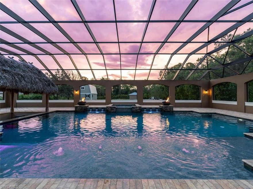 This ULTIMATE estate home awaits you with unrivaled outdoor living & privacy, yet still convenient to high-end shopping, restaurants & top-rated schools all within minutes of the beach! Your indoor/outdoor oasis comes complete with a 5,000 sqft screened rear lanai enclosure, custom 45’ pool, 6-person spa, swim-up Chickee bar, summer kitchen & fireplace. Interior features include a gourmet kitchen, great room, library/den/study, game room, first floor master suite, additional first floor master/guest suite & loft. The chef and host in you will enjoy the expansive kitchen complete with 2 islands, Wolf gas range, 2 electric wall ovens, refrigerators, dishwashers, wine fridge & large walk-in pantry. Commercial grade whole-house generator, reverse osmosis water system & laundry on 1st & 2nd floors ensure comfort & convenience. Equipped with newer AC Units & Water Heater! Outbuilding with power is ready to be finished as a custom office, she shed, man cave or workshop! Perfectly situated on 2.26 acres with close proximity to shopping, hospitals, top-rated schools, and less than 5 miles to Gulf beaches and the high-end retail stores & fine dining of Mercato & Waterside Shops.