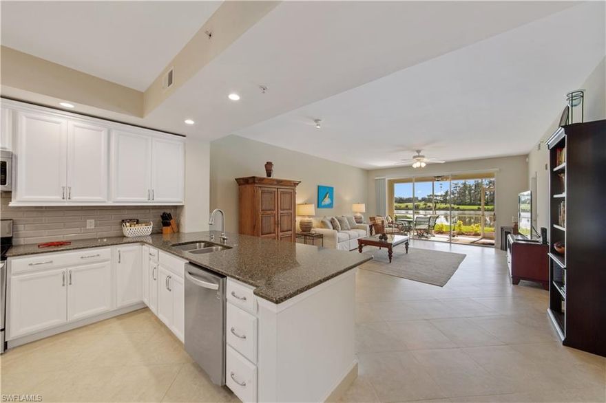 GORGEOUS FIRST FLOOR condo that has been completely updated. Sold TURNKEY.  Amazing golf and lake views.The best first floor condo available right now in the desirable community of Ravenna Way in Pelican Preserve.  An award winning and nationally recognized 55+ community with a 27 hole Championship GOLF COURSE with one of the best club houses in the area.  Completely updated kitchen with stainless appliances and new backsplash tile and granite countertops. Designer style tray ceiling in the master bedroom which opens up to the screened-in lanai with INCREDIBLE lake and golf course views. With a new hot water heater and newer AC system, there is nothing this place needs so its move in ready today.   The building roof was also just replaced by the HOA. Pelican preserve is an awesome community that has all you need. Two restaurants, a state of the art and large fitness center, 3 resort style pools, a movie theater, pickle ball & tennis courts, baseball fields, dog parks, and so many other actitivities too many to list. The last time this unit was for sale it sold FAST!  Ground level units like this don't become available often in communities like this.