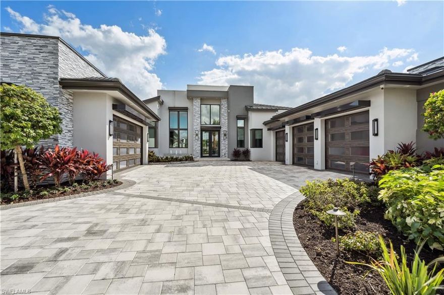 Your search for the perfect home and community is over. Your amazing lakefront home features an unimaginable combination of elegance, comfort and relaxation and it's waiting for you in the award winning community of Miromar Lakes. As you enter this breathtaking home, the first thing that captivates the senses is the abundance of natural light from the12' tall impact sliders. This home features 4,856 square feet of fabulous living space and contains five bedrooms, six baths, four fireplaces, a breathtaking cabana, huge den and room for 5 cars in the two climate controlled garages and a whole home generator. The open design with expansive wine room, natural gas stove, fabulous refrigerator and huge walk-in pantry along with four ovens makes this kitchen every chef's dream come true. When you're done playing on the lake or enjoying the award winning amenities at the clubhouse, unwind and relax by the pool in the evening and be enthralled by the glow of the stunning 12' fire pit. Make your dream home a reality today.