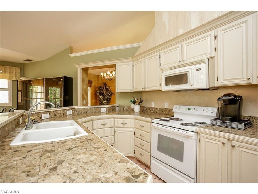 Location, Location, Location! What you've been looking for, West of Wilson on 2.5 acres! Home features 3 bedrooms, 3 baths, breakfast nook, Family room, vaulted ceilings, tile roof & a 2 car garage. As you approach the home, you will notice the concrete circular driveway and the beautiful high and dry land with plenty of space for all your toys. This lot is 165' wide by 660' deep. Bright and spacious kitchen, great for entertainment with plenty of counter space. Home is completely tiled throughout and has a huge under trusses lanai great for those summer days. Home has plenty of space for a pool and a guest house if you choose to build one in the future. Don't miss this home close in with with almost 2,000sqft under air. Schedule your showings today!