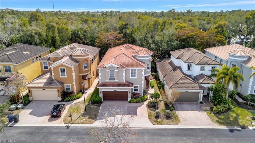 Welcome to spacious living in the gated Copper Oaks community of Estero—this 5-bedroom, 4-bath home offers over 3,100 sq ft, a 2-car garage, and an extra-wide paver driveway. Located just steps from the community pool and clubhouse, it delivers both space and convenience in a prime Estero location.
As you step through the front doors, you’re greeted by a bright, airy foyer with soaring ceilings and abundant natural light. Enjoy tranquil lake views from the front entry and front bedroom windows, creating a peaceful everyday backdrop. There is no carpet anywhere—tile and luxury vinyl flooring run throughout, complemented by wood stairs and a finished wood stairwell that add warmth and character. The kitchen features real-wood cabinetry, granite countertops, stainless steel appliances, and a walk-in pantry, with an open flow to the main living and dining areas—perfect for entertaining or comfortable daily living. The layout is highly functional for guests or multigenerational living. The first floor includes a guest bedroom and full bathroom, plus a dedicated laundry room with a utility sink. Upstairs, you’ll find two primary suites—each with its own bath—plus two additional large guest bedrooms that share another full bathroom, along with ample storage space. Step outside to the screened lanai and enjoy a tranquil patio setting framed by lush landscaping that creates a private, preserve-like feel. Key updates include a roof replacement in 2021, a newer water heater, and a professionally painted interior. Copper Oaks amenities include a clubhouse, community pool, fitness center, play area, bike/jog paths, and sidewalks. Low HOA fees include lawn care among many other benefits you'll enjoy as a resident of Copper Oaks. Conveniently located near Miromar Outlets, Coconut Point, Florida Gulf Coast University, Three Oaks schools, RSW International Airport, Southwest Florida beaches, and I-75—surrounded by shopping, restaurants, and attractions. Exceptional space and value in Estero.