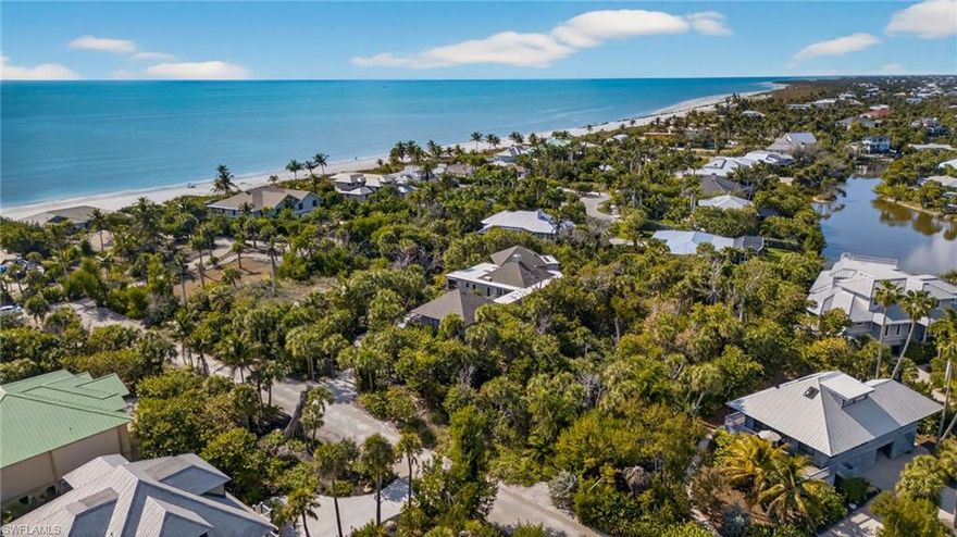 This is a rare opportunity to build a custom island retreat just three parcels from the Gulf of Mexico and only a short distance from the beach in Sanibel’s sought-after Gulf Pines community. Tucked along the private and picturesque Strangler Fig Lane, this exceptional homesite offers tranquil lake views and a distinctive feature, a private accessible easement to the beach from rear of the property, shared by only a select few neighboring parcels, providing convenient and quiet access to Sanibel’s renowned shoreline. Oversized by Sanibel standards at more than one-half acre, this expansive lot provides privacy and exceptional design flexibility for a future residence. The property is in the Ecological Zone D2 Upland Wetland designation, allowing for approximately 25% impermeable coverage and 30% developed area, creating a rough building envelope of approximately 6,098 square feet under the impervious coverage ratio and 7,318 square feet under the developed area ratio (buyers to verify). This generous footprint presents a compelling opportunity to design a substantial island home that fully embraces the surrounding natural setting. Beyond its proximity to one of Sanibel’s pristine stretches of beach, residents of Gulf Pines enjoy an array of desirable community amenities, including a large community swimming pool, tennis courts and a charming clubhouse, all within a short distance of the property. Opportunities of this caliber are increasingly rare on Sanibel. With its oversized dimensions, unique rear beach easement, peaceful lake views and prime position just moments from the Gulf, this exceptional homesite offers the ideal canvas to create a remarkable tropical sanctuary where location, lifestyle and long-term value align.