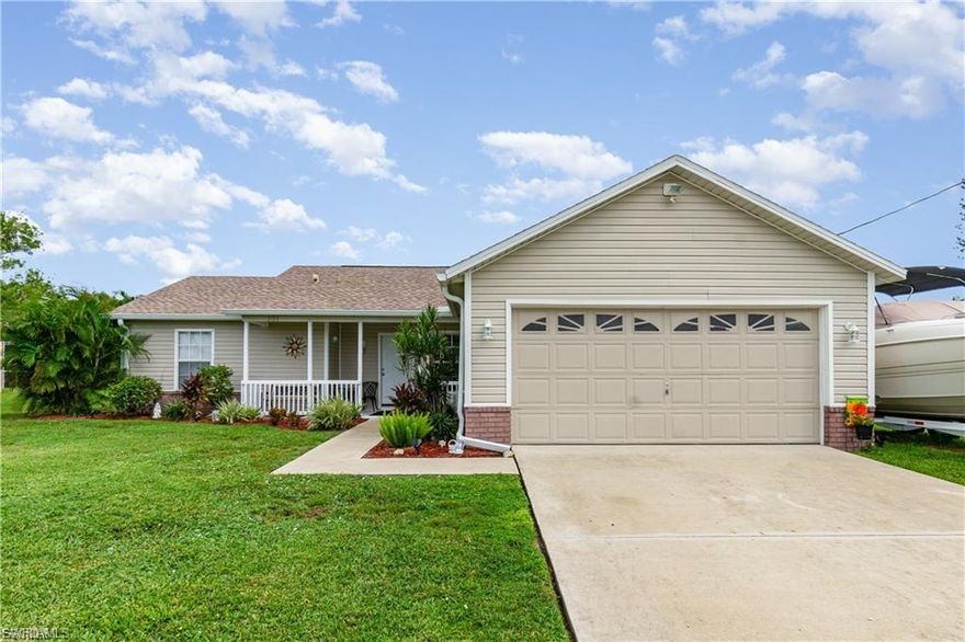 This Southwest Cape Coral pool home delivers updated systems, low maintenance, and a practical layout. Upgrades include a 2023 roof and HVAC, plus 2024 interior paint and butcher block countertops. Hard-surface flooring throughout, vaulted ceilings in the main living area, and no carpet. The kitchen connects directly to the dining and living spaces for an efficient flow. The screened pool area offers privacy with mature landscaping and a fully fenced backyard. Easy pool entry steps and ample deck space for seating. Exterior updates in 2024 improved curb appeal, and the home features classic vinyl siding rather than Mediterranean styling common to the area. City water and sewer with all assessments paid. No HOA and no deed restrictions. Not located in a flood zone. Positioned near Veterans Pkwy, Surfside Blvd, and Chiquita Blvd for straightforward access to shopping, dining, and schools. Assumable Loan: The existing mortgage may be assumable by a qualified buyer. Terms depend on lender approval. Major mechanical updates, a private pool setting, and a convenient location make this a strong value option in Southwest Cape Coral.
