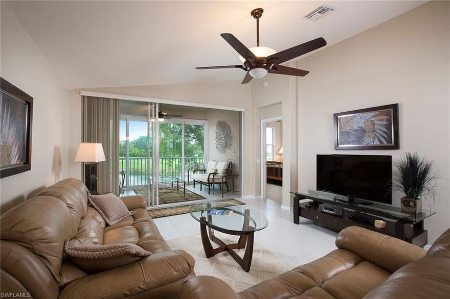Enjoy a mile-wide view from this spectacular turn-key furnished Orchid end residence! Shows like a model and the owners have taken impeccable care of the two-bedroom-plus-den, two-bath open plan. Features and new upgrades include hurricane glass-enclosed lanai (2016), making this space enjoyable year-round. New hot water heater, 2013 new carpet and linen coastal tile installed and carried through the lanai, all new appliances in 2015, new master bathroom shower and tile detail, decorator light and fan fixtures, custom master bedroom closet and more. Convenient location only moments away from the neighborhood community pool. Spring Run is a bundled golf community and all owners are members of all the lifestyle activities. Recently renovated clubhouse, Gordon Lewis 18-hole golf course, four Har-Tru® tennis courts, heated community pool and spa, bocce ball courts, grill and bar, pro-shop, fitness, library and the option of joining the Commons Club private beach membership, fitness and spa with personal trainers available, The Rookery restaurant, short drive to the airport and Coconut Point Mall for dining and shopping. Spring Run is in the perfect central, quiet location.