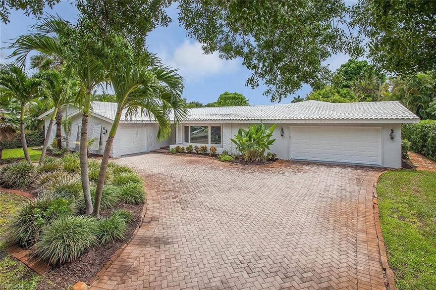New Listing, Lovely Coquina Sands, just blocks from the beach and Old Naples. This tropical oasis  is move in ready.  You will love the split floor plan with 4 bedrooms , den ( possible bedroom )  and three  baths.  Rarely available three car garage and a large lot with an abundance of fruit tree's.  Prior owner was a local artist. Enjoy a light and bright artist retreat with high ceilings and  its own  side  entrance and patio or use as private office . This home is perfect for entertaining with a large brick paved sun deck and large  screened in
 pool . 
 The location is superb, walk to the Naples Beach Hotel and Golf Club for free concerts on the green. Also within walking distance of the world famous Lowdermilk Park public beach and First Watch Restaurant. 
Enjoy the Florida lifestyle in this home located in the Old Naples, Moorings area.
The lots is over sized at .40 of an acre. Home was previously rented for $5k per month annual.