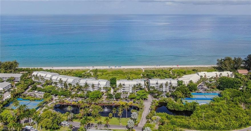 Discover your slice of paradise in this exquisitely renovated two-bedroom, two-bathroom condominium nestled within the prestigious South Seas resort on enchanting Captiva Island. This direct gulf front sanctuary seamlessly marries coastal elegance with contemporary sophistication, offering an unparalleled retreat where pristine white sugar sand beaches meet your doorstep. Step into a world where luxury meets comfort, featuring a completely transformed interior reimagined with elevated coastal décor and new contemporary furnishings that whisper tales of seaside serenity. The thoughtfully designed space includes stainless steel appliances, luxury vinyl tile flooring, and a walk-in shower plus a shower-tub combination for ultimate convenience. Impact glass sliders frame breathtaking sunset vistas over the Gulf of Mexico, while native plants and swaying palms create a natural masterpiece beyond your windows. This turnkey residence comfortably accommodates six guests, making it an exceptional investment opportunity with outstanding rental potential. The building's recent comprehensive renovation includes a striking new standing seam metal roof, fresh exterior paint, updated laundry facilities, refreshed pool area, and an enchanting turtle-safe lighted boardwalk leading directly to the beach. Your participation in Club Captiva membership unlocks a treasure trove of world-class amenities that transform everyday living into extraordinary experiences. Dedicated staff will arrange your beach chairs and umbrellas while you indulge in seaside dining, exhilarating water sports, fitness facilities, seaside golf, Captiva Landing waterslides, and the meandering lazy river. Resort trolley service, supervised kids camp, and countless recreational activities ensure every moment brims with possibility. Embrace the subtropical climate where warm winters and tropical summers create an idyllic backdrop for abundant wildlife encounters. Watch pelicans dive for lunch, dolphins frolic in azure waters, or try your luck catching snook. The healthy outdoor lifestyle beckons with beach walks, pickleball, tennis, and swimming in crystal-clear waters. Beyond the resort's boundaries, adventure awaits at nearby attractions including the renowned J.N. "Ding" Darling National Wildlife Refuge, scenic Redfish Pass, and the pristine Pine Island Sound. Captiva's unique positioning offers easy access to charming upper islands for delightful lunch excursions and exploration. This meticulously maintained property features thoughtful touches like a convenient shell cleaning station and beautifully relandscaped grounds adorned with vibrant flowers and towering palms. The building's comprehensive renovations ensure worry-free ownership while the prime location guarantees enduring value in one of Florida's most coveted destinations.