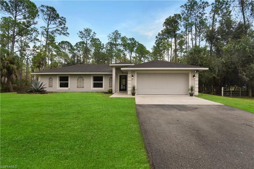 Renovated home on over 2 acres! Situated in a non-gated neighborhood on 2.34 acres of land, this single family home has been updated with gorgeous tile flooring throughout, new a/c unit, custom trim including crown molding, country 10 lite doors throughout, and new washer & dryer. Beautiful kitchen w/ designer cabinets, stainless steel appliances, tile backsplash, bay window system w/ eat-in area, and breakfast bar. Fantastic home for a growing family w/ a split bedroom floor plan, oversized 2-car garage, cathedral ceiling, great room layout, open rear lanai, and a fenced in backyard that has plenty of room for a pool and/ or playset. Both bathrooms in the home have been renovated w/ the master having a frameless glass enclosed shower, and all bedrooms have walk-in closets. Very convenient location-close to all the needs of life while being surrounded by old Florida natural landscaping. Just miles from the Neighborhood Shoppes at Orange Tree offering Publix & much more!