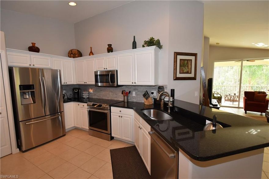 TURNKEY FURNISHED on a peaceful lanai setting at the edge of a beautiful preserve/marshland nature trail. Top floor 2 plus den "Orchid" end unit boasts light all day with sunny southern exposure and long views down the nature trail path. Kitchen boasts white cabinets against gorgeous black flecked granite countertops, Samsung Stainless Steel appliance package including built-in convection stove, French door refrigerator, & under mount sink for huge pots & pans. Track lighting added to show off the beauty of it all! Tiled throughout living including lanai with carpet in bedrooms and den. This condo is on the pay as you play golf side of a bundled golfing community where you have golf privileges but don't pay for the golf course. Fill your day with Tennis, Pickle Ball, Bocce Ball, 7 community pools, State of the art fitness center, Restaurant with weekly entertainment in the sports bar, miles of nature trails, walking paths, activity room, library, & Wifi station. Walk or ride your bike to the clubhouse for a game of tennis or a drink at the sports bar. Close to airport and Twins & Red Sox training camps. COME AND LIVE THE COUNTRY CLUB LIFESTYLE !!