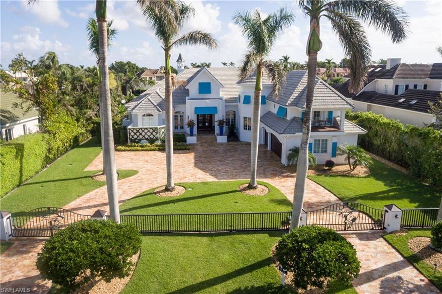 This classic Port Royal gated property envelops you in understated elegance and charm both inside and out with over 100 feet of water frontage on Runaway Bay.  Recent additions include new tumbled marble circular drive and walkways, pool deck, oversize spa and patio with elongated view of the waterway leading to the Gulf of Mexico. The  oversized dock can accommodate three vessels.  This custom home features new hardwood floors, and large first floor master suite complete with two full luxury baths and oversize walk-through closet. Complimenting the first floor spacious floor plan is a large office, wine tasting/pub room, formal dining room for a 90” round table and a formal living room with double sided fireplace to the master bedroom.  The fully equipped kitchen adjoins the family room and breakfast nook with large windows overlooking the water. One of the best values in Port Royal. Immediate membership in Port Royal Club residential property available.
