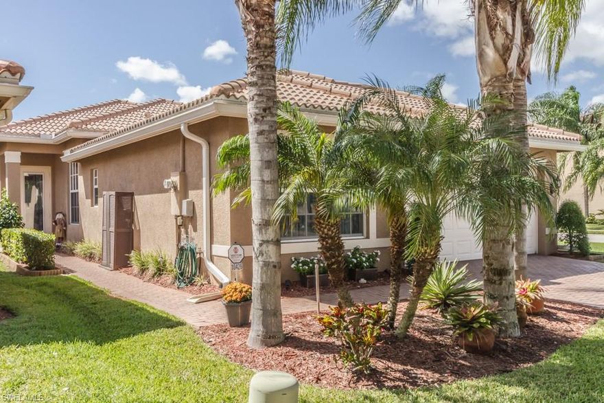 THIS GORGEOUS CORNER LOT ORCHID MODEL IS READY FOR A NEW OWNER! Featuring tile throughout main living Areas. Kitchen offers breakfast bar, granite counters/backsplash and 42" raised wood panel cabinets complete this space with crown molding and undermount lighting on the cabinets. Whole house water softener system included in purchase. With over 1,700 square feet of living space this 3 bedrooms / 2 Full bath home makes for a perfect starter home, 2nd home or retirement home. Partial lake views from your own private 15' x 20' extended patio surrounded by lush landscaping that will make anyone jealous. Lennox A/C approx 1 year old and newer hot water heater. At this price, this home will not last! Call now before it's gone. Botanica Lakes is one of SW Florida's most exciting communities offering an incredible lifestyle and a great value, too! Botanica Lakes features over 100 acres of open space and natural preserves and 32 acres of lakes in a prime location off the Treeline Corridor. Botanica Lakes has something for everyone.