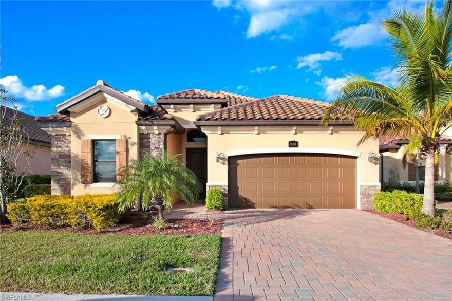 You’ll fall in love with this gorgeous home from the minute you pull into your pavered driveway and take in the sophisticated, colorful facade of stucco and stone. This home comes with a social membership to Bonita National Golf and Country Club, a beautiful, amenity rich, gated community designed around a wildlife preserve. The star of this home is the large lanai where you will spend most of your time lounging in the pool and spa overlooking the preserve or grilling for family and friends in the convenient summer kitchen.  The large open great room is light and bright with stunning tray ceilings with crisp, clean crown molding over elegant tile flooring and a charming focal wall anchored by a gas fireplace. The sophisticated kitchen features a wealth of white, shaker cabinets with stainless steel appliances and a large island with plenty of seating. The generous main bedroom allows pool access and includes a spa-like ensuite boasting dual sinks with built-in vanity, large walk-in shower and s delicious soaking tub nestled under the window. Three more bedrooms and two more well appointed bathrooms round out this lovely home.