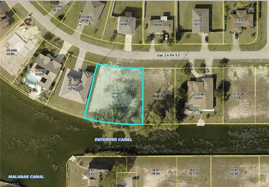 Triple Lot .42 acres located in the heart of Cape Coral on a freshwater canal. Almost a 1/2 acre right off of Veterans Parkway next to shopping and restaurants. Incredible Location. Build your dream home here with plenty of space and beautiful water views.