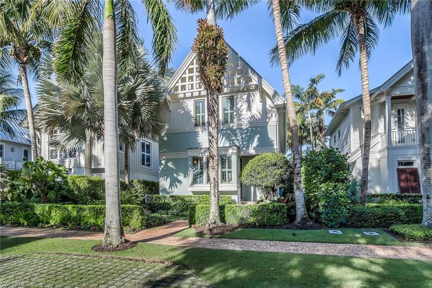 Exquisitely appointed with sophisticated luxury, this stunning Old Naples home located on the beautiful tree-lined 6th Street South, is just a short stroll to the beach and 5th Avenue South. The Gables on 6th is one of Olde Naples' most sought-after masterpiece developments designed by Harrell & Associates. It encompasses seven homes with a gated entry to the rear driveway, parking and a private three-car, air-conditioned garage with a car lift and built-in cabinetry. The light and bright open floor plan featuring 4,306 square feet showcases beautiful hardwood plank and stone flooring, a chef's redesigned kitchen with luxury appliances, custom cabinetry, a generous island, a 450-plus-bottle wine room and a half bath. The spacious great room with expansive walls of glass windows adjoins the dining area and the outdoor area that features a lanai with glass inserts in the deck, suspended over the swimming pool and private spa. A summer kitchen, a gas fireplace and electric screens complete this space. The second floor features three beautiful en suite bedrooms and a private, spacious master suite with an open balcony and a beautiful master bath with fine finishes.