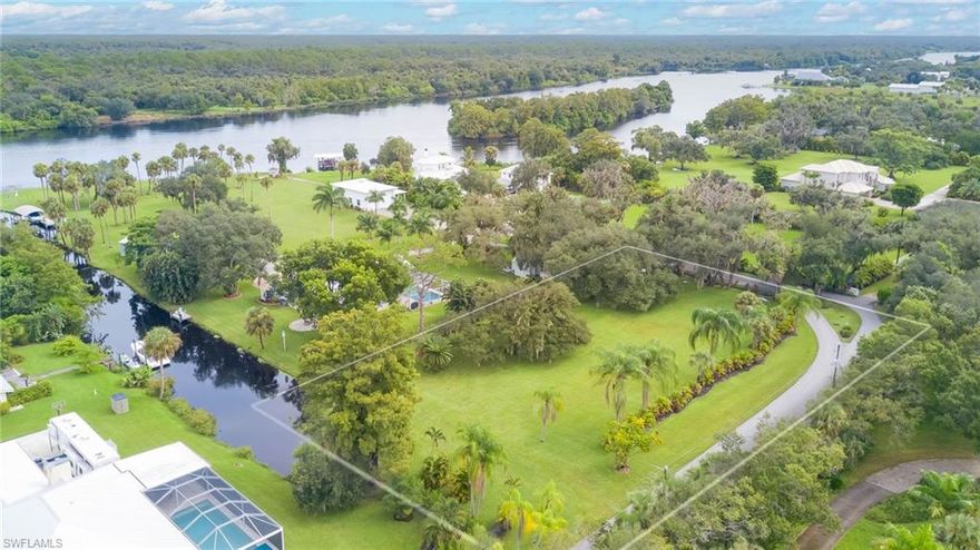 Looking for the perfect waterfront acreage property to build your own private estate in a quaint country setting? Check out this gorgeous, cleared and ready to build on lot offering 1.42 acres of prime real estate located in a small, private gated community of only 2 other homes with direct access to the Caloosahatchee River. It’s the perfect spot for boating, fishing, watersports or simply soaking in the peaceful river views. The property is level and features beautiful, mature trees including majestic live oaks, pines and palms. Plenty of room at the end of the canal in a protected area for your new boat dock too just minutes to the river! Ideally situated just off I-75, it offers easy access to major roadways and is only minutes away from the rapidly growing Babcock Ranch, which includes new shops, a grocery store, and restaurants. For entertainment and cultural attractions, the lively Downtown River District is just a short drive away. Nothing else like it for that price with an unbeatable location, and serene riverfront setting, this lot offers an incredible opportunity to build your dream home in a tranquil yet convenient part of Alva.