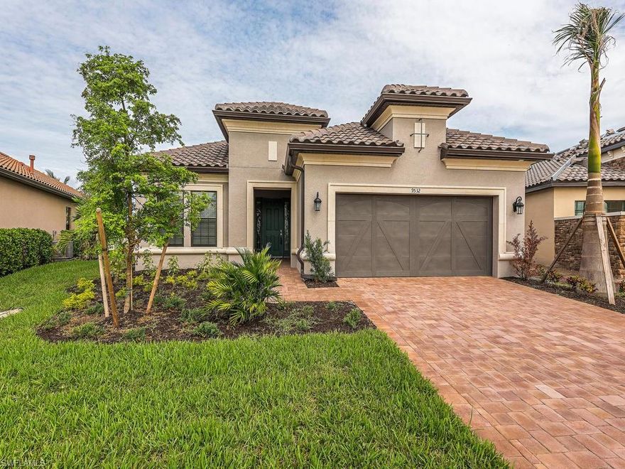 This home has never been occupied and is brand new!  Large water view and plenty of outdoor space, both covered and uncovered give this home great entertaining possibilities.  The home is situated on a large cul-de-sac lot with abundant side yards.  Featuring every upgrade available including huge garage, hard tile floors on ALL surfaces, tray ceilings, crown molding, cabinets, built in appliances, outdoor kitchen with bar, impact windows and doors, and a walk in shower for all.  Very low fees with the CDD debt service paid off!!  Fiddler's Creek offers world class amenities including Social Club, Day Spa, state of the art Fitness Wing, Tennis, and options for Golf, Beach, and Marina.