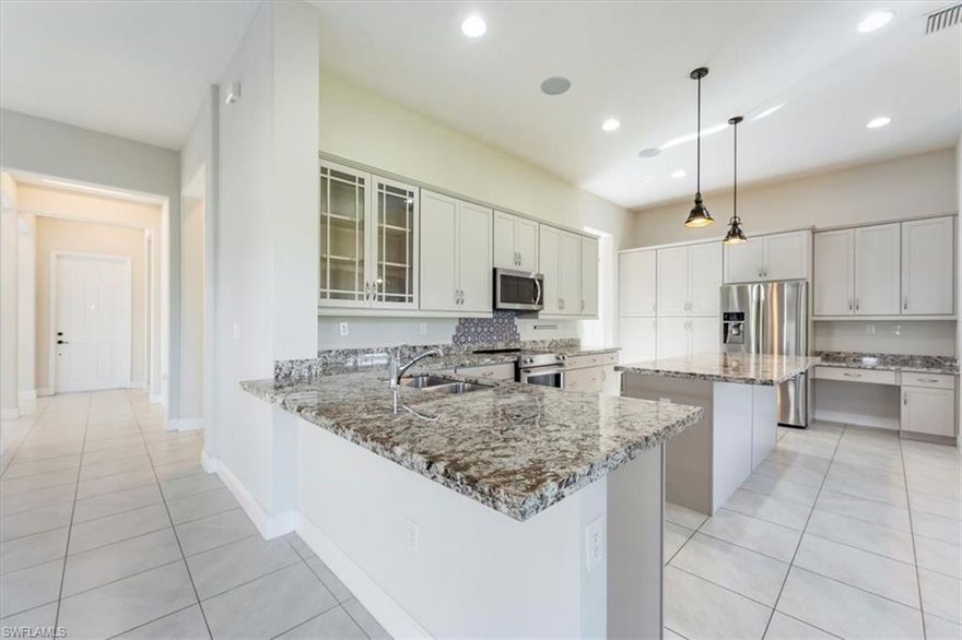 Beautiful Lakefront Home in Maple Ridge. Welcome to this stunning Danby model offering 4 bedrooms plus a loft, 3 full baths, and 3,270 sq. ft. under air. This well-maintained home blends style, comfort, and functionality, with thoughtful upgrades throughout. Enjoy built-in surround sound on the first floor, extending seamlessly to the screened lanai—perfect for entertaining or relaxing by the lake. The chef-inspired kitchen features 42" shaker cabinets with crown molding, thick granite countertops, upgraded refrigerator, cooktop stove/oven, large island, built-in desk, and updated light fixtures. Additional highlights include impact glass and doors (with shutters for first-floor windows), garage door opener, and numerous premium finishes. Community Perks: Maple Ridge offers an incredible lifestyle with endless amenities—shopping, dining, bars, bike/walking trails, grocery store, car wash, gas station, dog parks, sports fields, basketball and tennis courts, pickleball courts, pavilions, playgrounds, and more. At the heart of it all is The Club at Maple Ridge, featuring a resort-style pool, pickleball court, grilling area, exhibition kitchen, fitness room, sauna, and outdoor calisthenics areas. So much to do, so much to see—right at your doorstep.