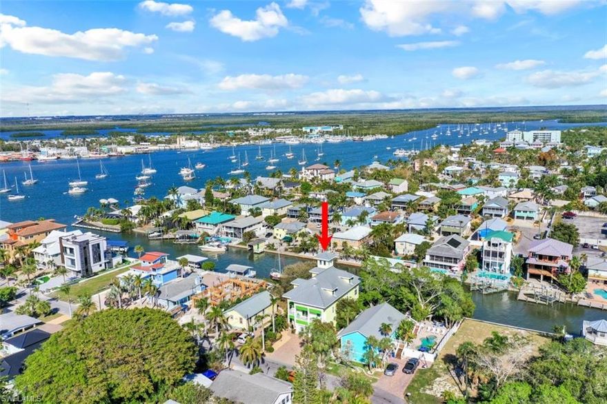 Paradise awaits! This custom waterfront resort style home affectionally known as “Fresh Squeezed” is filled w/upgrades and is being offered turnkey. Upon entering the residence, you are welcomed in the Grand Foyer.
This level has a full-size game room, entrance to pool/spa/shower/sundeck and dock area, bedroom, and half bath. The grand staircase or private elevator welcomes you to the upper floors. On main level, enjoy soaring ceilings, great room, chef inspired gourmet kitchen w/island seating, water view dining area, stacking "wall of windows" to lanai overlooking pool/spa/dock/outdoor kitchen & beautiful bay/canal views. The 1st master bedroom suite is well appointed, w/large lanai, and den w/private balcony. The next level offers a 2nd master bedroom suite, private screened lanai, 2 large bedrooms and full bath, all of which grace this level. The top level, via a circular staircase has a rooftop “crow's nest" sitting area for panoramic views of the Gulf, back bay, and the beauty of Estero Island. The white sand of Fort Myers Beach is a short sail from your private dock or a 7-minute walk from "Fresh Squeezed" to beach area activities, restaurants, and shopping at Times Square.