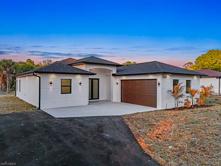 Prime location! NEW CONSTRUCTION READY TO MOVE-IN in Golden Gates Estates. Beautiful 3 bedrooms PLUS den, nestled on 1.14 acres, 100% uplands with no HOA restrictions. The open-concept layout boasts high-end finishes throughout. The kitchen has quartz countertops, custom cabinets, a waterfall peninsula, stainless steel appliances and a pantry for storage. Key features include; all impact windows and doors, automated sprinklers system, epoxy garage floor, led mirrors and a tankless water heater. This property has been professionally cleared and landscaped, paved driveway with access to the back. Don't miss this opportunity to own your own slice of paradise!