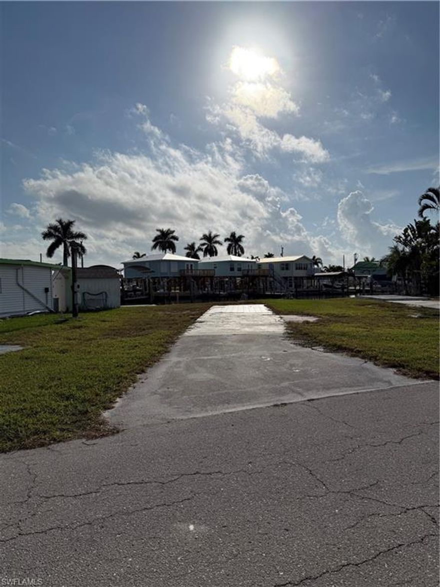 Wide canal, beautiful sunsets, deep, quick access to the gulf and all the fishing, boating, beaches, and restaurants that's available.  Mobile home was removed so you can benefit from low impact fees.  Utilities are disconnected, but are there.