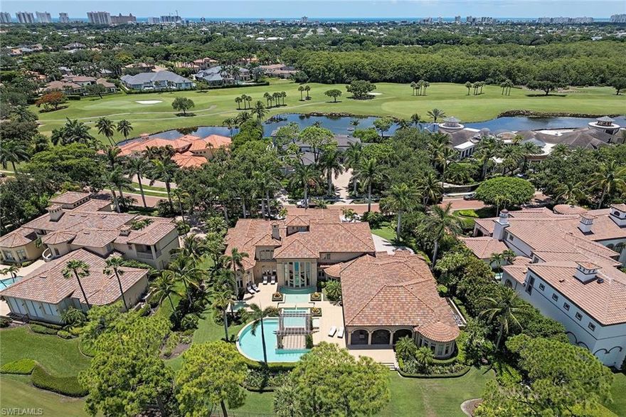 Luxurious estate in Bay Colony Golf! A life of unmatched elegance. On a premier golf course lot within the prestigious, guard-gated Bay Colony Golf Estates, this custom two-story home offers 8,976 square feet of thoughtfully designed living space. With four bedrooms, six baths and a three-car garage, the home blends spaciousness with sophistication. Designed for comfort and style, the residence features a private elevator, home theater, wine closet, multiple wet bars, a custom library, and a gourmet kitchen that opens to expansive indoor-outdoor living areas. High ceilings, quality finishes, and a seamless floor plan create an inviting environment for both everyday living and entertaining. Outdoors, the resort-style pool and spa, covered lanai, outdoor kitchen and private guest cabana provide a peaceful and private setting for relaxation or hosting. As a member of Bay Colony, you'll enjoy exclusive access to the Bay Colony Beach Club, offering beachfront dining, bar service and attended beach amenities. The community also features a private tennis center and is ideally just minutes from The Ritz-Carlton, Naples white-sand beaches, and world-class dining and shopping.